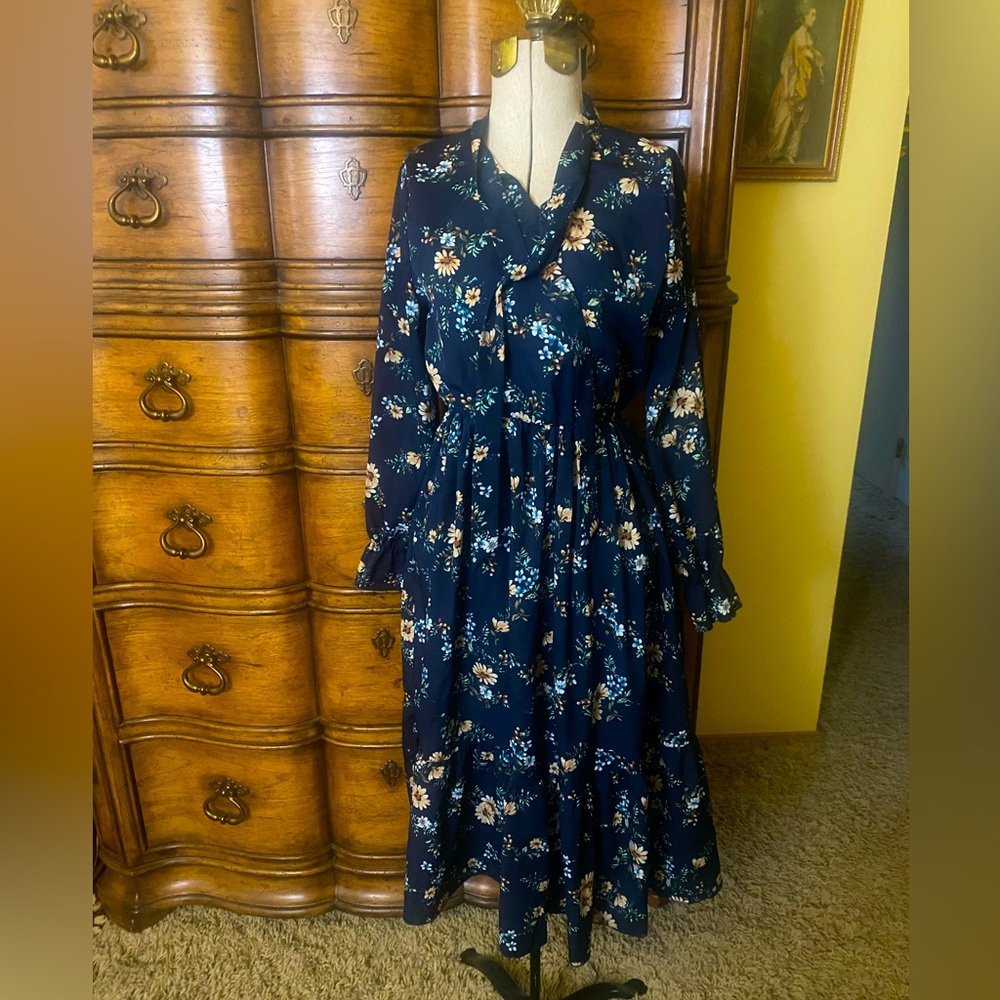 Blue floral dress with elastic waist. Fits like a size small
